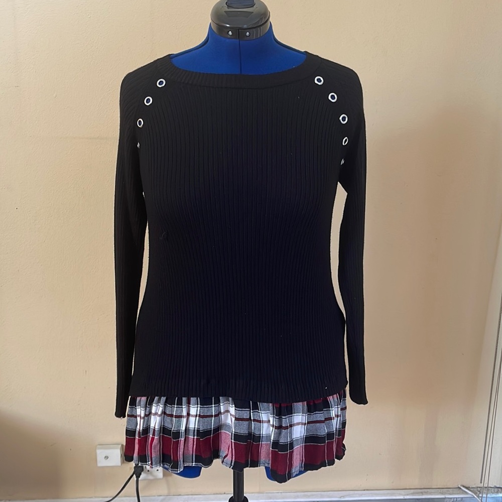 A torrid black knitted shirt size 1X (14/16) with a plaid bottom.
